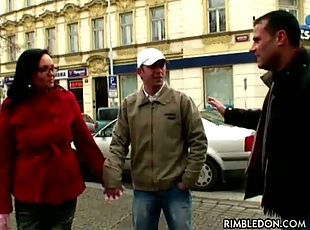 A couple is approached on the street by a Dutch television team whi...