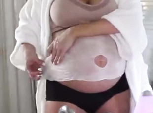 Sexy Pregnant Blonde disrobes to her bra&panties