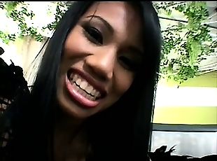 Petite thai bitch smiles while taking a massive black schlong