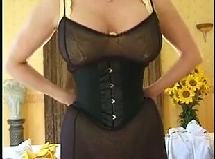 Busty MILF with heavy nipple pussy piercings in corset