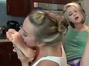 Lesbian licks teen girl& 039;s soles in the kitchen