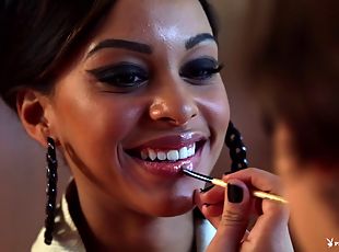 Beautiful ebony-skinned chick with a fabulous body laughing and chatting backstage